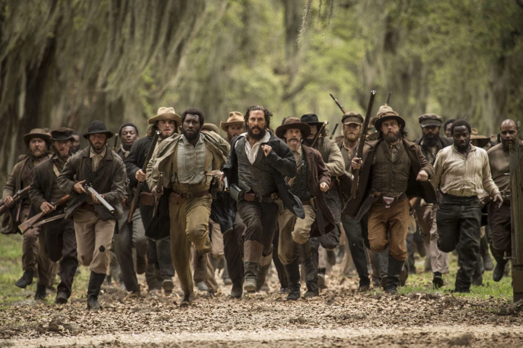 Matthew McConaughey (center)  and Mahershala Ali (center left) star in THE FREE STATE OF JONES